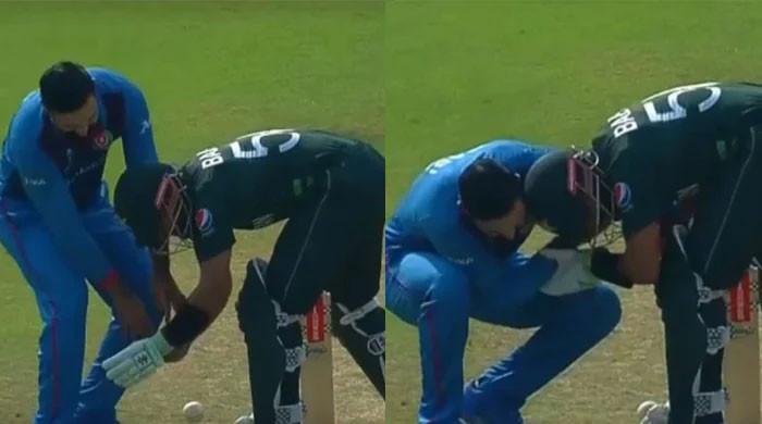 WATCH: Babar Azam stops Afghanistan's Mohammad Nabi from tying his shoelaces