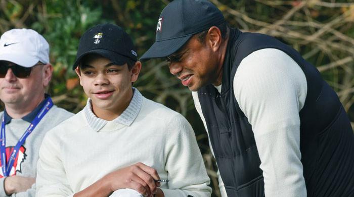 Tiger Woods fondly caddies son Charlie at Notah Begay III Junior Golf Championship